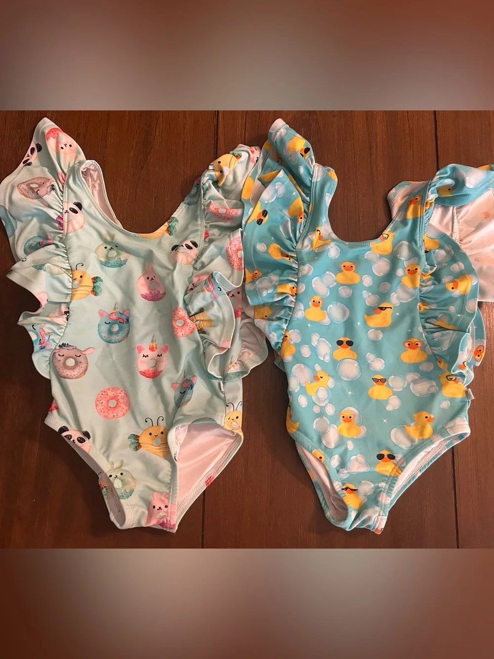 Two 2T Posh Peanut swimsuits